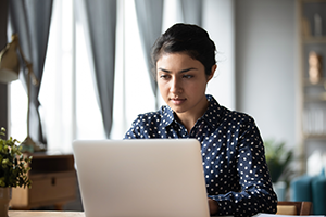 A woman working on a laptop