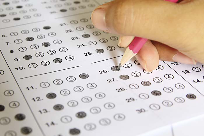 A student filling in answers for a test