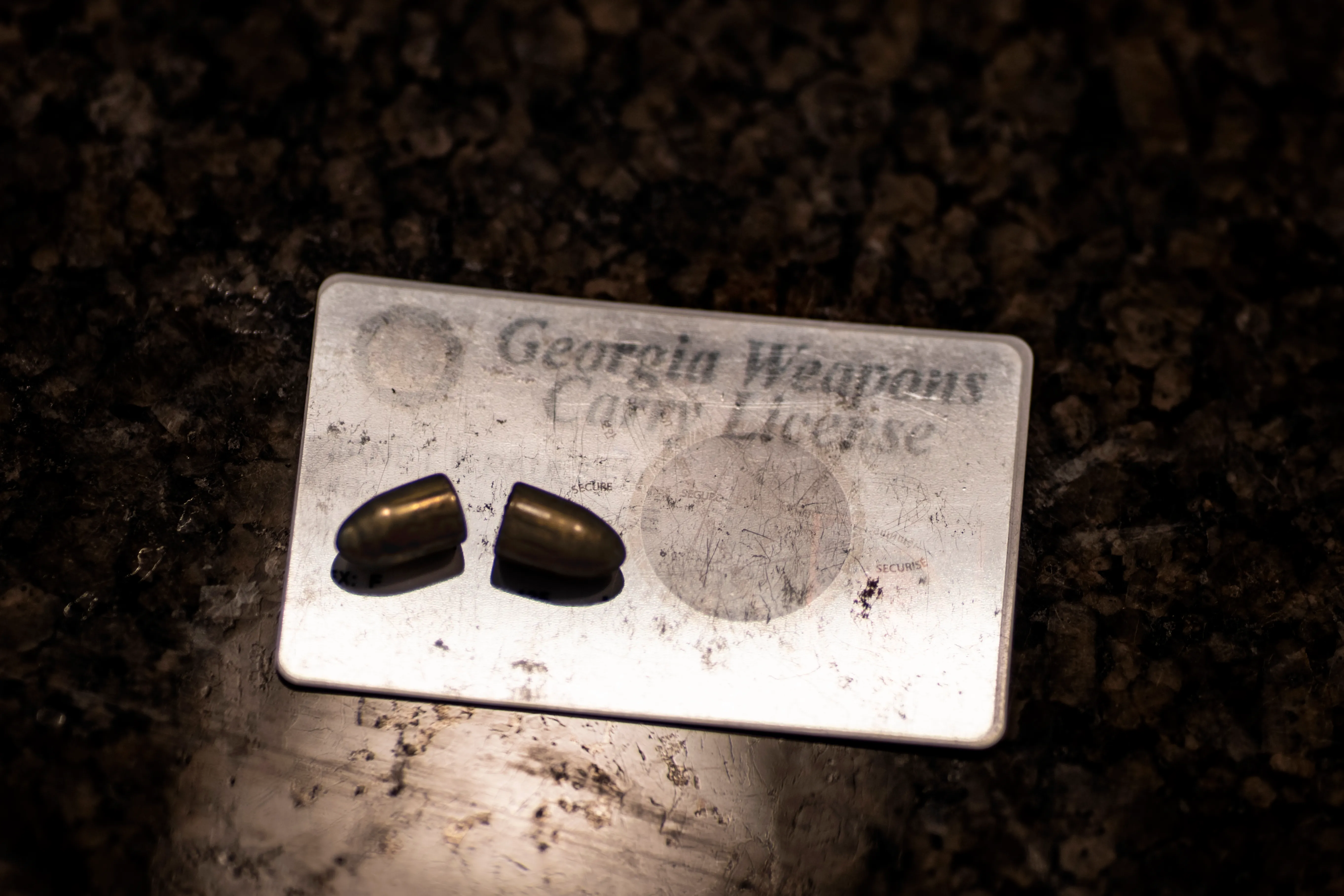 A Georgia weapons carry license with 2 bullets.