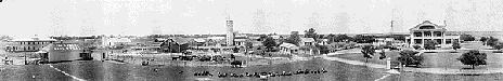 View of farm buildings, residences, ranch hands, farm machinery, and animals at the 101 Ranch in Oklahoma, between Ponca City and Perry. The ranch was owned by the Miller family.