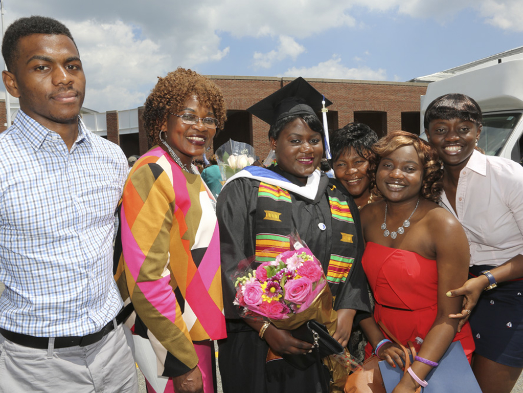 Family posing for photo at commencement