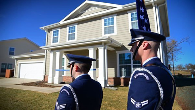 airmen walking with an American Flag